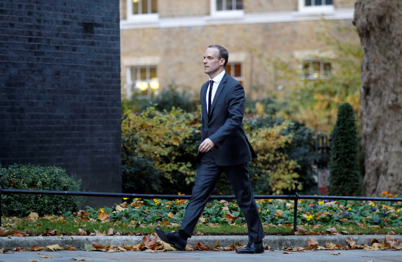 Dominic Raab walks up Downing Street, London, Britain, November 13, 2018. (photo credit: PETER NICHOLLS/REUTERS)