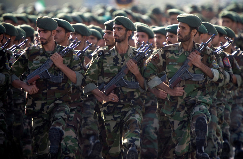 Members of Iran's Revolutionary Guards march during a military parade to commemorate the 1980-88 Iran-Iraq war in Tehran (photo credit: MORTEZA NIKOUBAZI/ REUTERS)