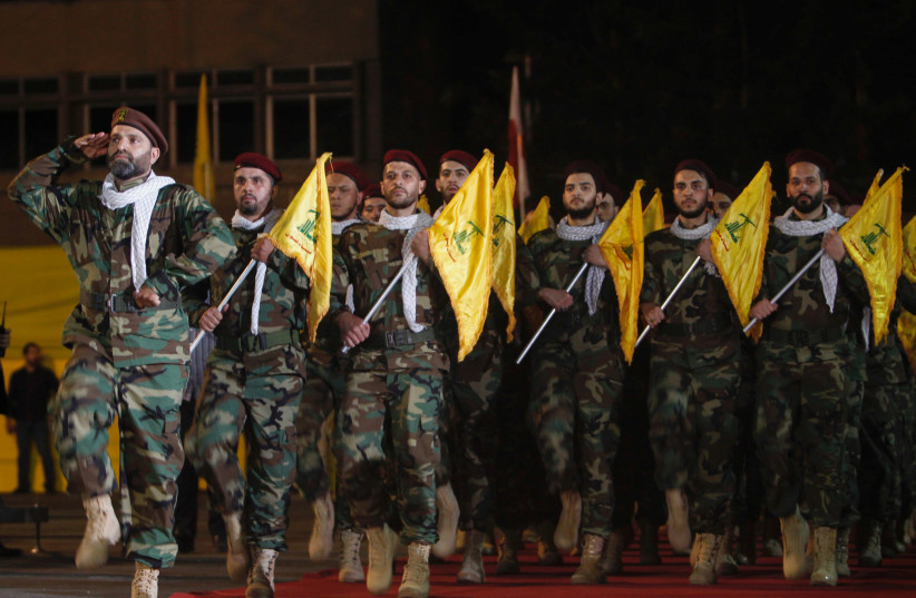 Members of Hezbollah march with party's flags during a rally marking al-Quds Day, (Jerusalem Day) in Beirut (photo credit: REUTERS)