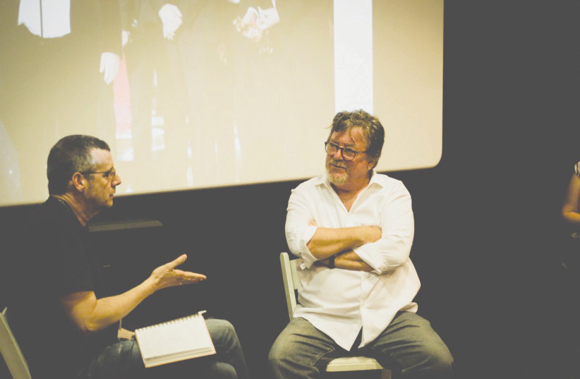 CHARLES WESSLER (right) is interviewed during a master class at the Jerusalem Film Festival (photo credit: MATAN KOCHMEISTER)