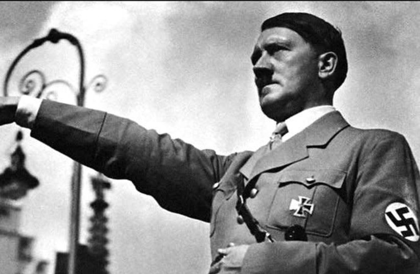 German Fuhrer Adolph Hitler doing a Nazi salute (photo credit: Wikimedia Commons)