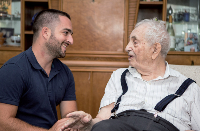 David and Shlomo: A volunteer from Latet, and one of the Aid for Life beneficiaries (photo credit: Courtesy)