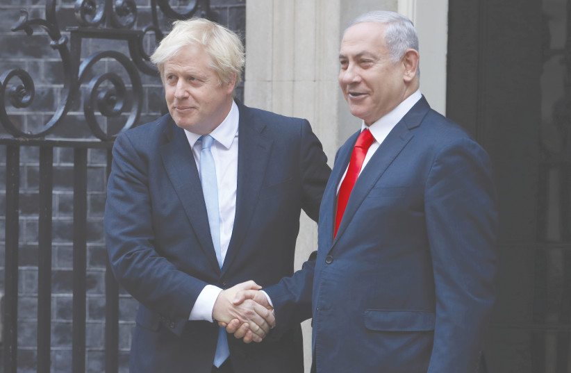 BRITAIN’S PRIME Minister Boris Johnson welcomes Prime Minister Benjamin Netanyahu to Downing Street in London, yesterday. (photo credit: SIMON DAWSON/ REUTERS)