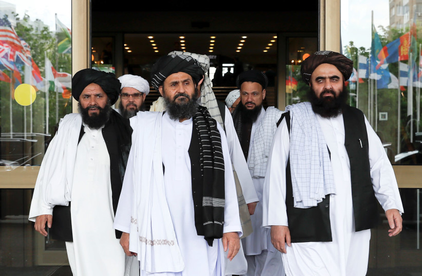 Members of a Taliban delegation leave after peace talks with Afghan senior politicians in Moscow, May 30, 2019 (photo credit: EVGENIA NOVOZHENINA/REUTERS)