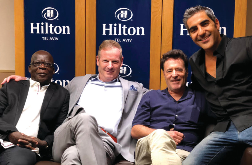 Pascal N’zonzi, Motti Verses, Philippe de Chaueron and Ary Abittan reunite last week in Tel Aviv for the Israeli premiere of ‘Lama Ze Magia Li?’ (photo credit: HILTON TEL AVIV)