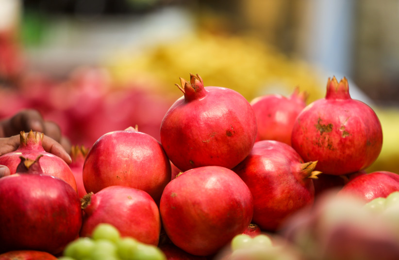 Pomegranates seen piled up at Machane Yehuda market, just in time for Rosh Hashana. (photo credit: MARC ISRAEL SELLEM)