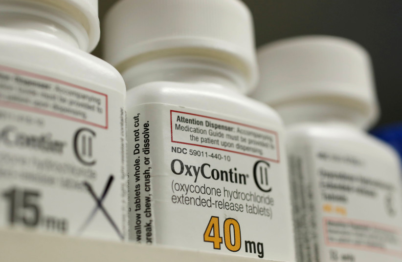 Bottles of prescription painkiller OxyContin, 40mg pills, made by Purdue Pharma L.D. sit on a shelf at a local pharmacy, in Provo, Utah, U.S. (photo credit: REUTERS/GEORGE FREY)