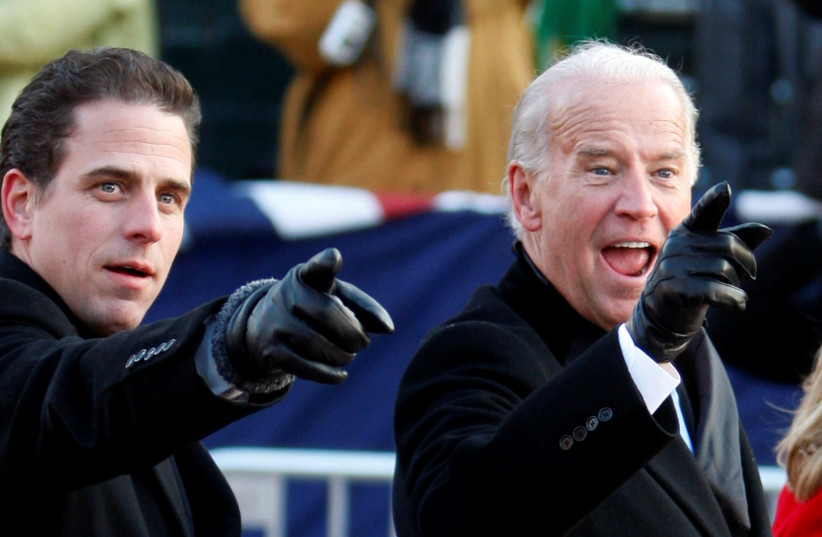 U.S. Vice President Joe Biden (R) points to some faces in the crowd with his son Hunter as they walk down Pennsylvania Avenue following the inauguration ceremony of President Barack Obama in Washington, January 20, 2009 (photo credit: REUTERS/CARLOS BARRIA/FILE PHOTO)