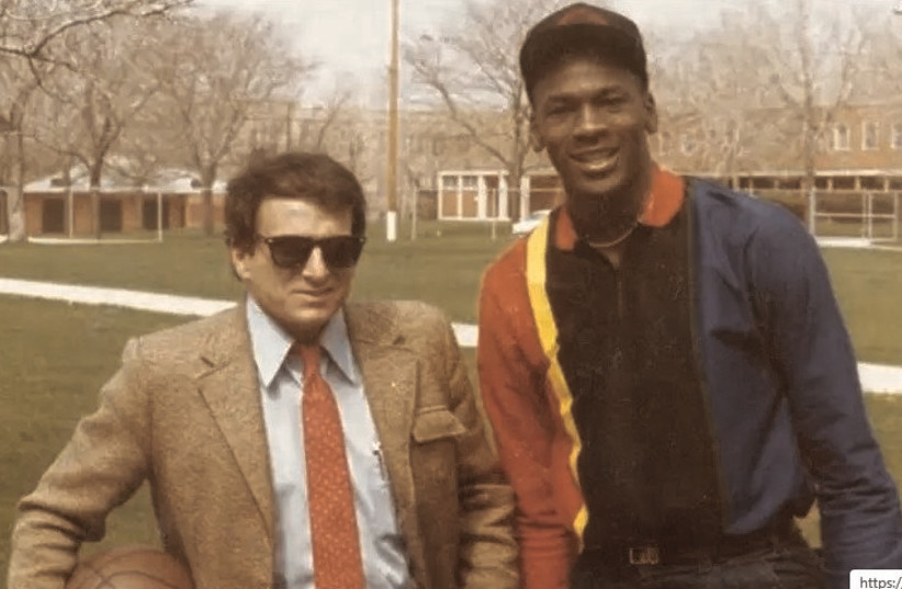 Arik Henig and Michael Jordan pose together in 1984. Henig, the man who put the NBA on the map in Israel, died this week at the age of 72. (photo credit: Courtesy)