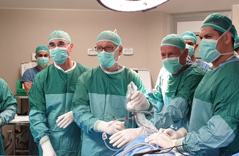 A team of surgeons performs an innovative meniscus transplant. (photo credit: ACTIVE IMPLANTS LLC)