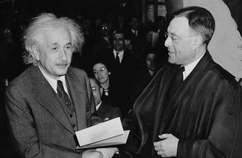 Albert Einstein receiving from Judge Phillip Forman his certificate of American citizenship. (photo credit: Wikimedia Commons)