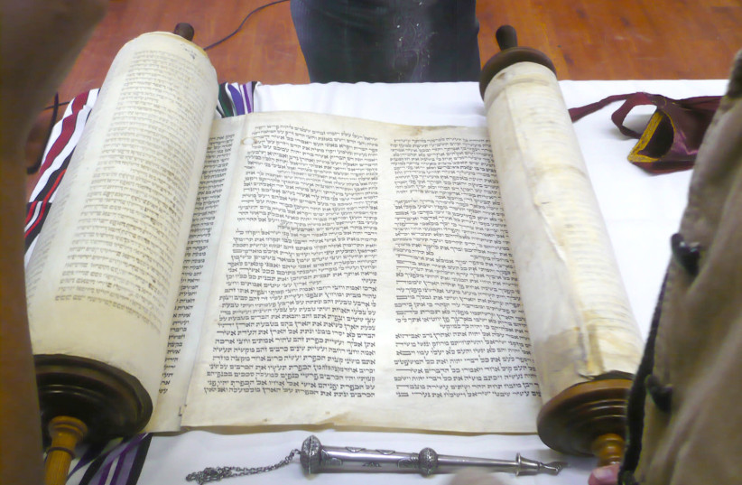 ‘HAVING CHOSEN God, the Torah is God’s response to us.’ Pictured: The Yanov Torah, rescued from the Holocaust. (photo credit: Wikimedia Commons)