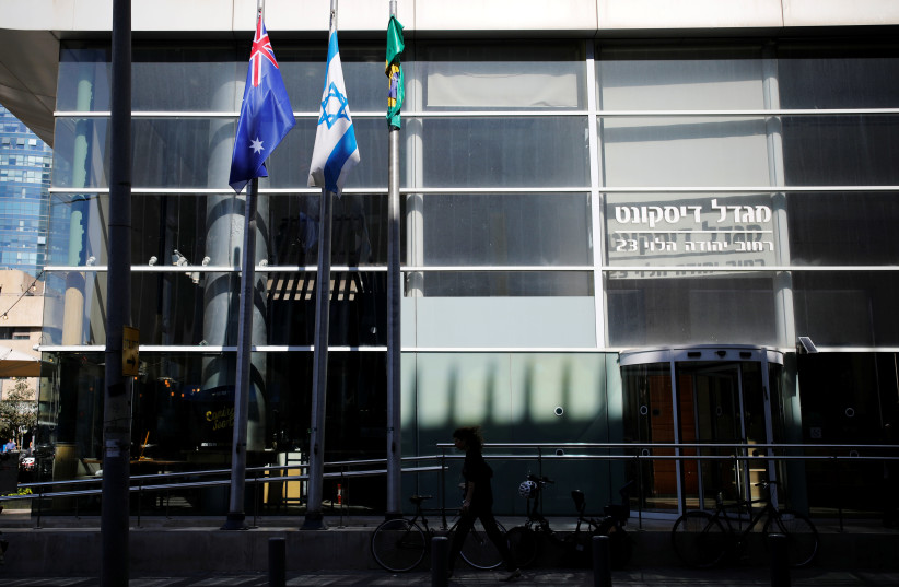 The national flags of Australia and Israel are seen outside the building housing the Australian Embassy in Tel Aviv (photo credit: REUTERS)