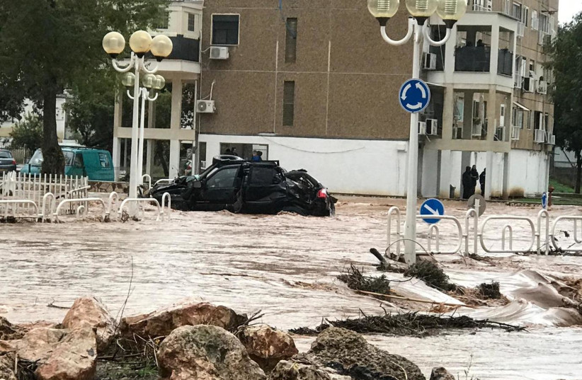 Nahariya man drowns in flood while attempting to save others (photo credit: NOAM FLAKSA/TPS)