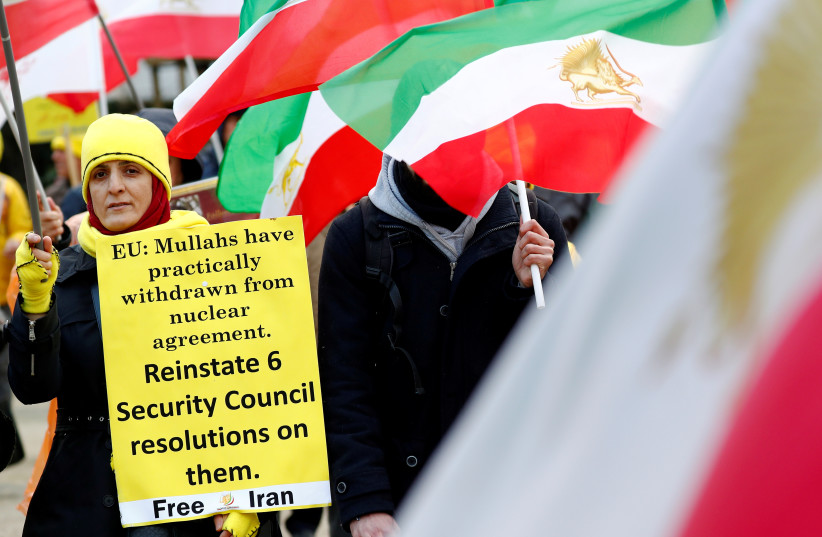 Supporters of the National Council of Resistance of Iran (NCRI) protest as European Union foreign ministers attend an emergency meeting in Brussels, Belgium, January 10, 2020. (photo credit: REUTERS/FRANCOIS LENOIR)