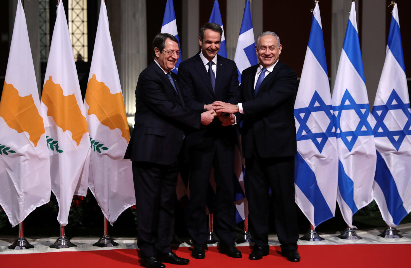 Cypriot President Nicos Anastasiades, Greek Prime Minister Kyriakos Mitsotakis and Israeli Prime Minister Benjamin Netanyahu pose for a photo before signing a deal to build the EastMed subsea pipeline to carry natural gas from the eastern Mediterranean to Europe, at the Zappeion Hall in Athens, Gree (photo credit: REUTERS/ALKIS KONSTANTINIDIS)
