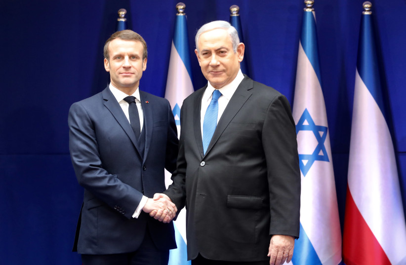 Israel's Prime Minister Benjamin Netanyahu and France's President Emmanuel Macron meet ahead of the 5th World Holocaust Forum, January 22, 2020.  (photo credit: MARC ISRAEL SELLEM)