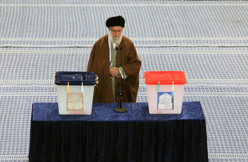 Iran's Supreme Leader Ayatollah Ali Khamenei casts his vote at a polling station during parliamentary elections in Tehran, Iran February 21, 2020 (photo credit: REUTERS)