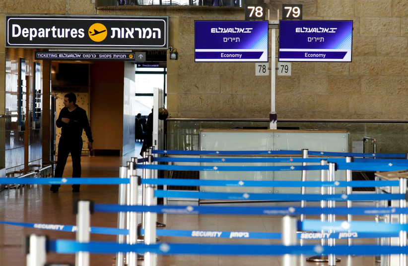 Empty El Al Israel Airlines check-in counters are seen at Ben Gurion International airport in Lod, near Tel Aviv, Israel February 27, 2020. (photo credit: AMIR COHEN/REUTERS)