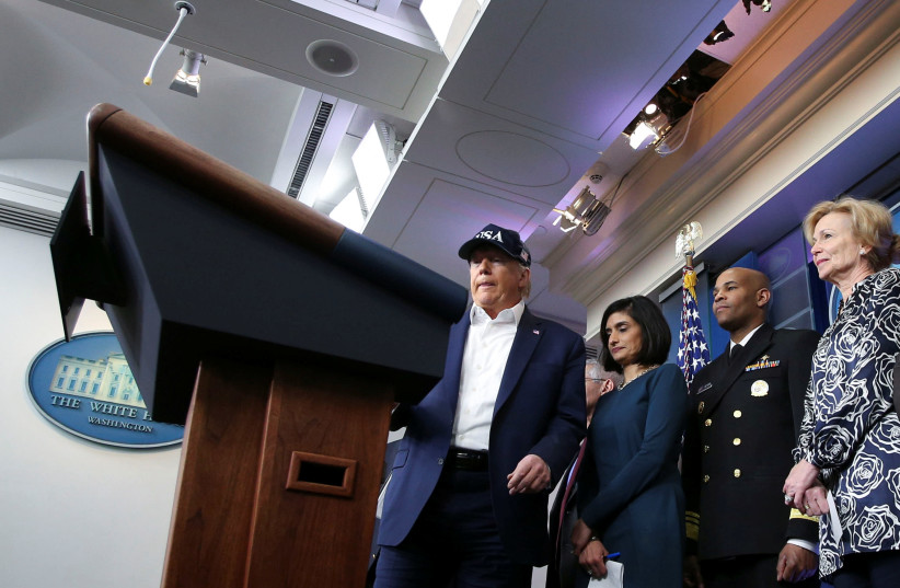 President Donald Trump with the Coronavirus Task Force hold a press briefing in Washington (photo credit: REUTERS)