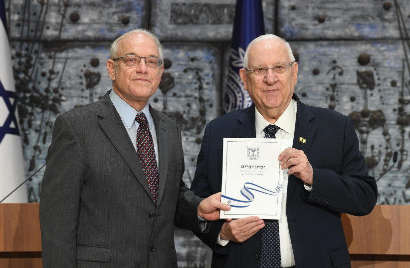 PRESIDENT REUVEN RIVLIN receives official election results to the 23rd Knesset from Chairman of the Central Elections Committee Justice Neal Hendel. (photo credit: MARK NEYMAN/GPO)