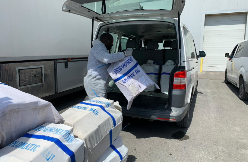 COGAT coordinates WHO delivery of coronavirus detection kits and protective masks to Palestinian Authority (photo credit: COGAT SPOKESPERSON'S OFFICE)