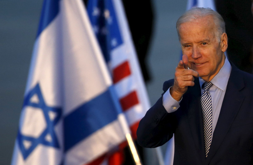 US President Joe Biden gestures after disembarking from a plane upon landing at Ben Gurion International Airport in Lod, near Tel Aviv, Israel March 8, 2016 (photo credit: REUTERS/BAZ RATNER)