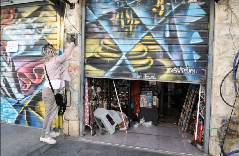 Shops begin to open in Jerusalem's Mahane Yehuda Market. (photo credit: MARC ISRAEL SELLEM)