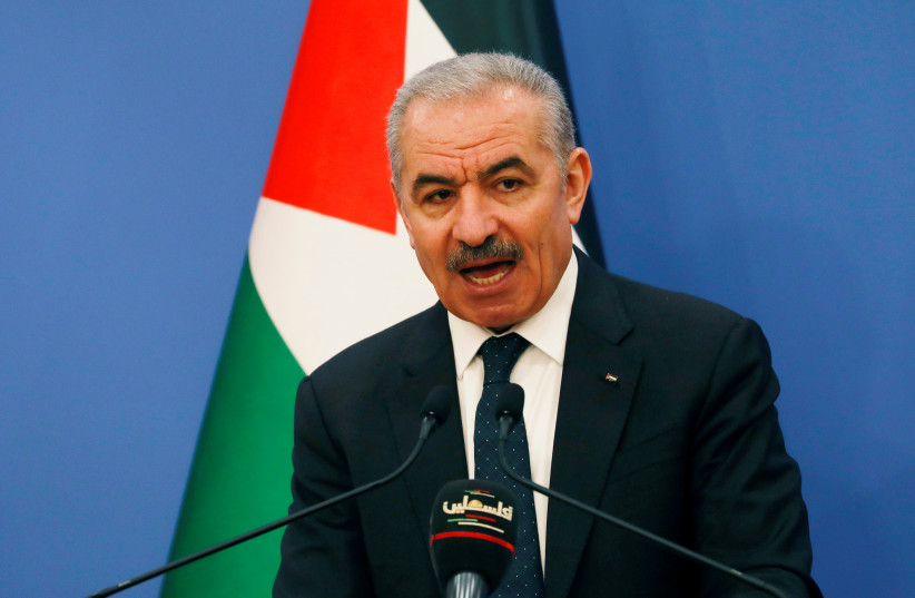 Palestinian Prime Minister Mohammad Shtayyeh speaks before the start of the weekly cabinet meeting in Ramallah, West Bank May 11, 2020 (photo credit: REUTERS/MOHAMAD TOROKMAN)