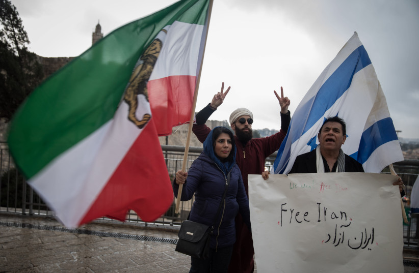 Iranian journalism, Nada Amin, who received asylum in Israel, organized a demonstration in support of the Iranian people and their protests against the regime in Iran, at Jaffa Gate in Jerusalem's Old City, on January 2, 2018. (photo credit: HADAS PARUSH/FLASH90)