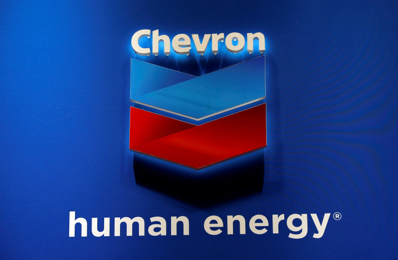 The logo of Chevron Corp is seen in its booth at Gastech, the world's biggest expo for the gas industry, in Chiba, Japan April 4, 2017 (photo credit: REUTERS/TORU HANAI)