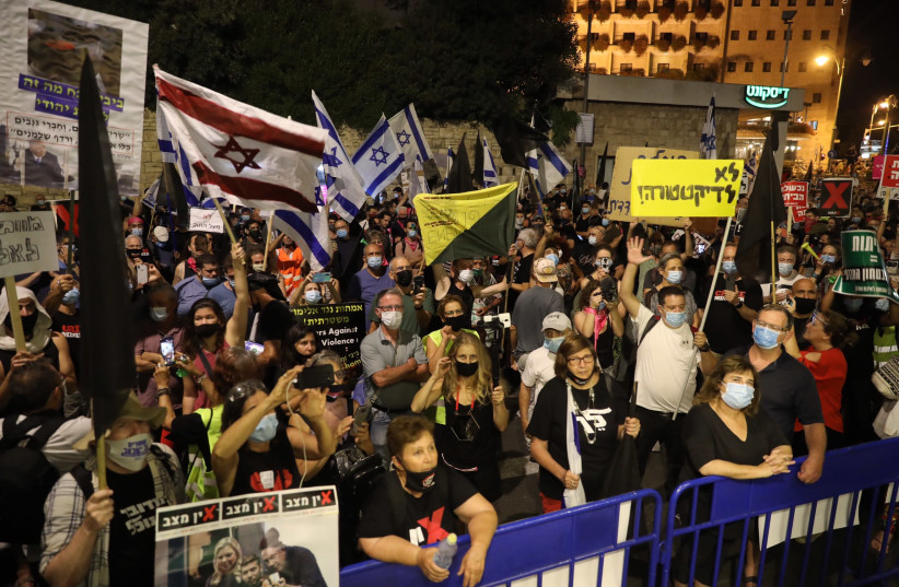 Protesters demonstrate outside of Prime Minister Benjamin Netanyahu's residence in Jerusalem (photo credit: MARC ISRAEL SELLEM)