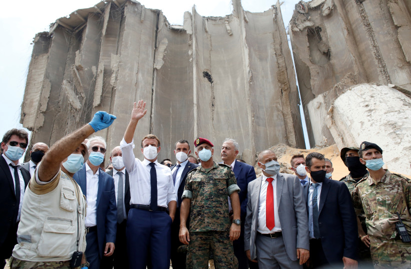 French President Emmanuel Macron visits the devastated site of the explosion at the port of Beirut on August 6 (photo credit: REUTERS)