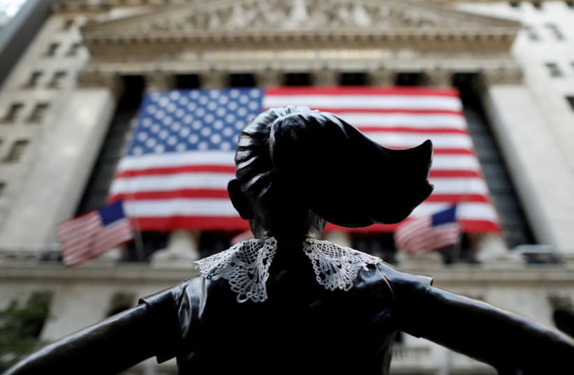 A jabot collar is seen placed on the Fearless Girl statue outside of the New York Stock Exchange (NYSE) in honor of recently passed Associate Justice of the Supreme Court of the United States Ruth Bader Ginsburg in Manhattan, New York City, U.S., September 21, 2020. (photo credit: REUTERS)