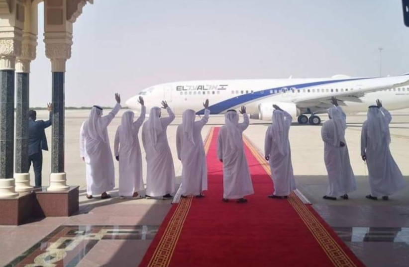 United Arab Emirates delegates wave to the departing El Al plane at the end of IsraelUAE normalization talks in Abu Dhabi on September 1 (photo credit: EL AL)