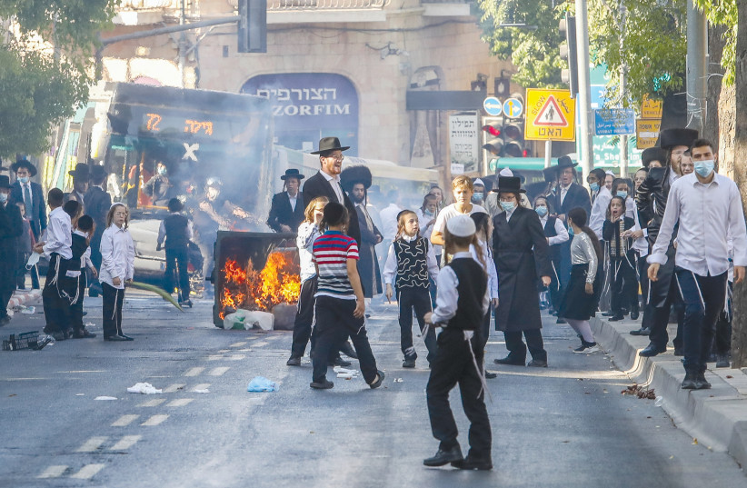 HAREDIM BURN garbage and protest enforcement of coronavirus restrictions in Mea She’arim earlier this week.  (photo credit: MARC ISRAEL SELLEM/THE JERUSALEM POST)