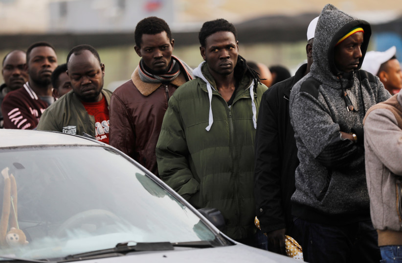 African migrants wait in line for the opening of the Population and Immigration Authority office in Bnei Brak, Israel February 4, 2018 (photo credit: REUTERS/NIR ELIAS)
