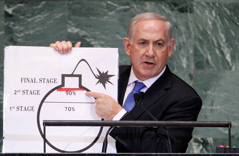 Israel's Prime Minister Benjamin Netanyahu points to a red line he has drawn on the graphic of a bomb as he addresses the 67th United Nations General Assembly at the U.N. Headquarters in New York, U.S., September 27, 2012. (photo credit: REUTERS)