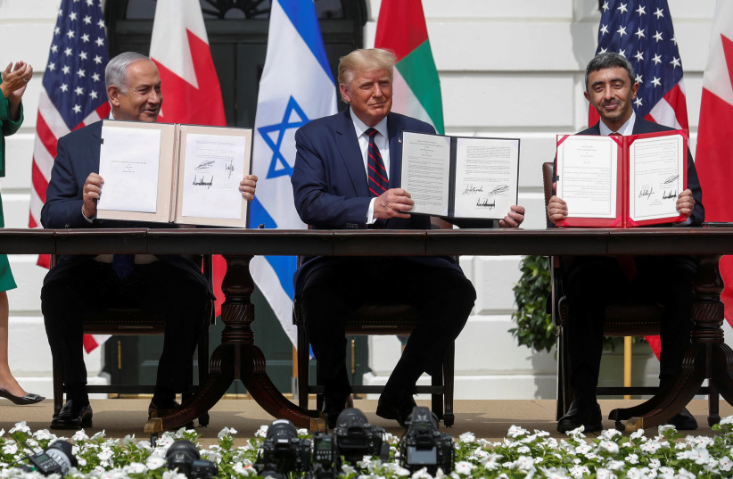 PRIME MINISTER Benjamin Netanyahu, US President Donald Trump and UAE Foreign Minister Abdullah bin Zayed signed normalization deals at the White House on September 15. (photo credit: REUTERS/TOM BRENNER)