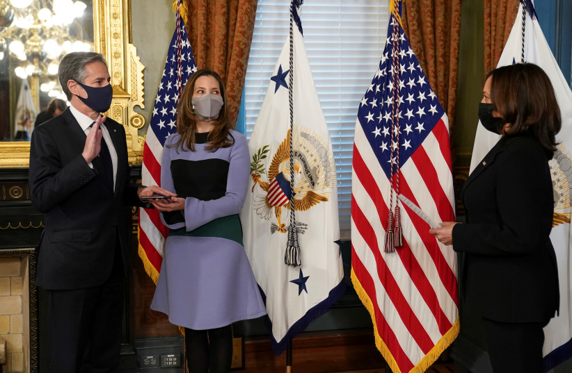 US Secretary of State Antony Blinken, with his wife Evan Ryan at his side, is ceremonially sworn in by Vice President Kamala Harris at the White House on January 27. (photo credit: KEVIN LAMARQUE/REUTERS)
