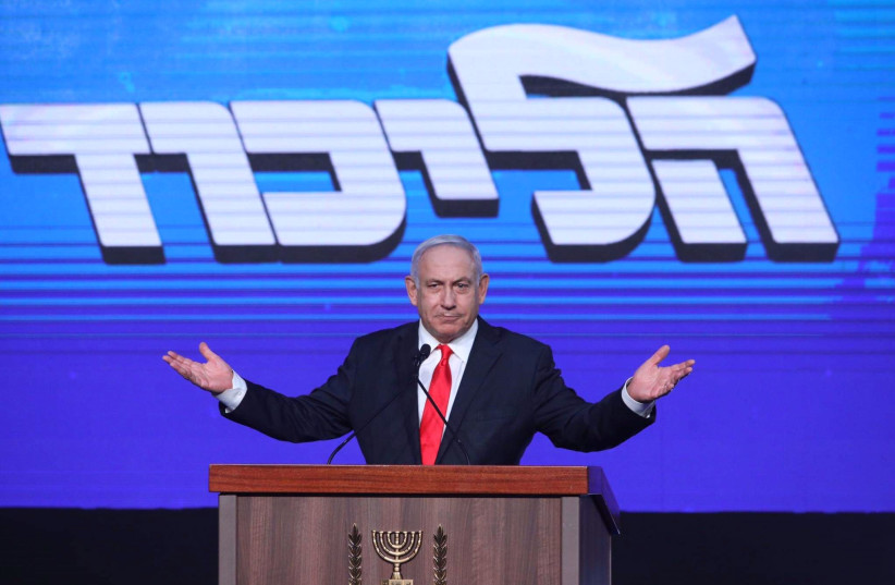 Prime Minister Benjamin Netanyahu speaks to his supporters after the exit polls were announced for the election of the 24th Knesset, March 24, 2021. (photo credit: MARC ISRAEL SELLEM)