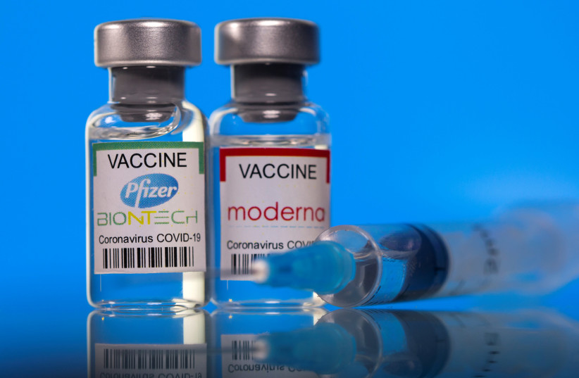 Vials with Pfizer-BioNTech and Moderna coronavirus disease (COVID-19) vaccine labels are seen in this illustration picture taken March 19, 2021.  (photo credit: REUTERS/DADO RUVIC/ILLUSTRATION/FILE PHOTO)