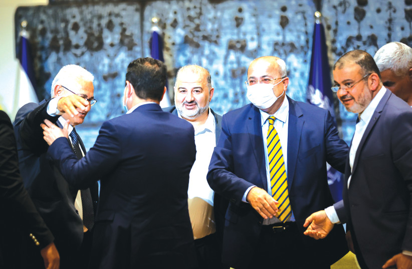 JOINT LIST MEMBERS greet each other after meeting with President Reuven Rivlin at the President’s Residence in Jerusalem on April 5. (photo credit: YONATAN SINDEL/FLASH90)