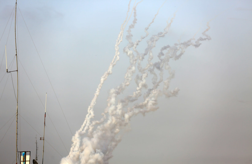 Smoke trails are seen as a rocket is launched from Rafah in the southern Gaza Strip to Israel on May 10, 2021. (photo credit: ATIA MOHAMMED/FLASH90)
