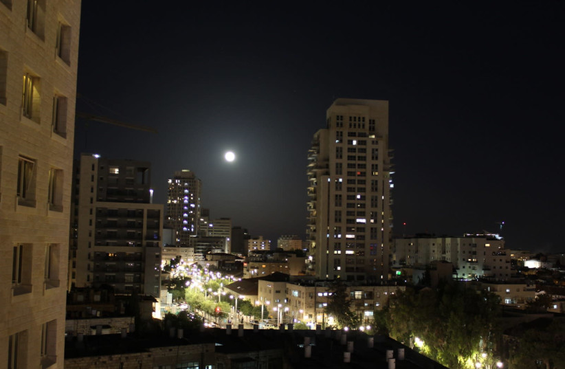 The Flower Moon is seen in the sky over Israel, May 26th 2021 (photo credit: ORI LEWIS)