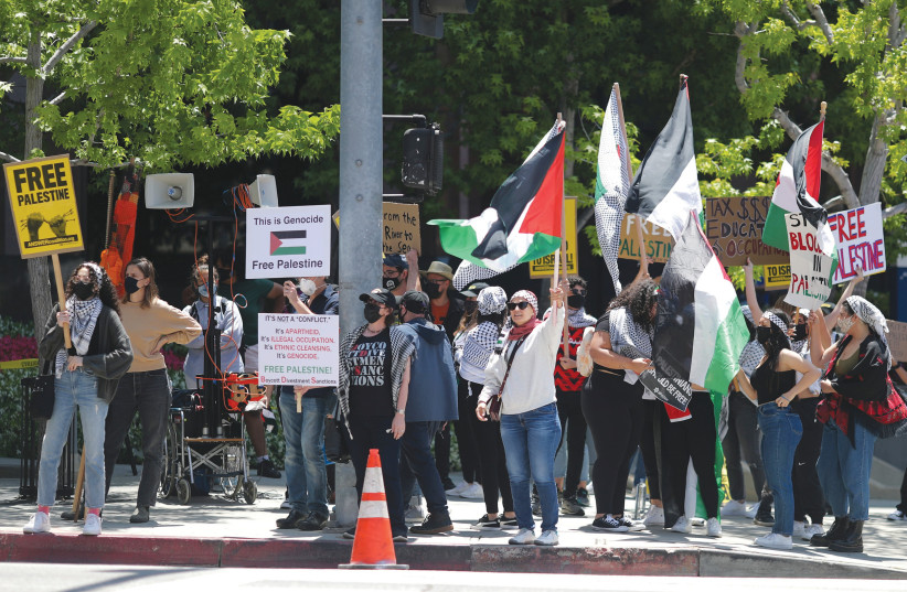 PRO-PALESTINIAN demonstrators attend a protest outside the Israeli Consulate in Los Angeles, earlier this month. (photo credit: LUCY NICHOLSON / REUTERS)