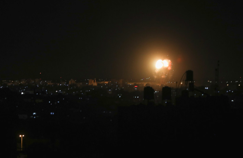 Smoke and flames are seen after an Israeli air strike in the northern Gaza Strip (photo credit: REUTERS/MOHAMMED SALEM)