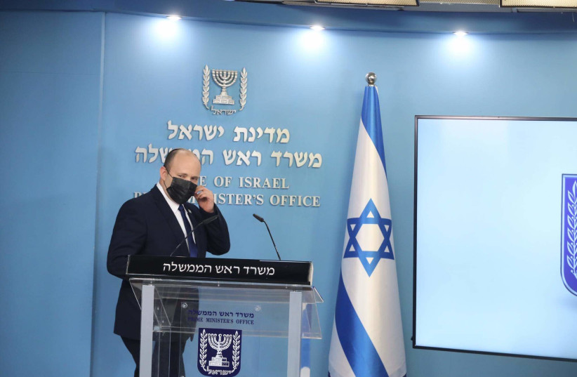 Prime Minister Naftali Bennett prepares to adress the nation at a press conference regarding the coronavirus pandemic, July 14, 2021. (photo credit: MARC ISRAEL SELLEM)