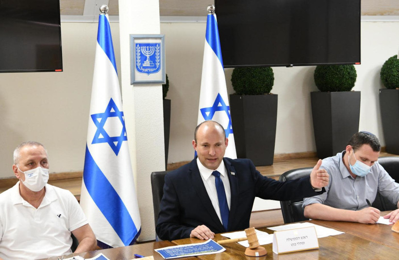Prime Minister Naftali Bennett addresses the coronavirus cabinet on Friday, July 16, as number of new cases rise (photo credit: ROEE AVRAHAM/GPO)