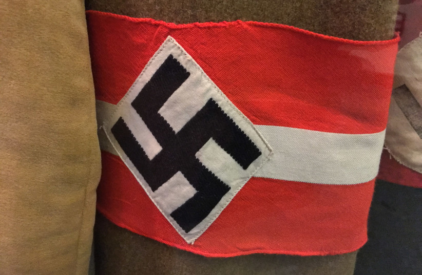 A Nazi armband with a swastika displayed in the Deutsches Historisches Museum, Berlin, Germany (photo credit: Wikimedia Commons)